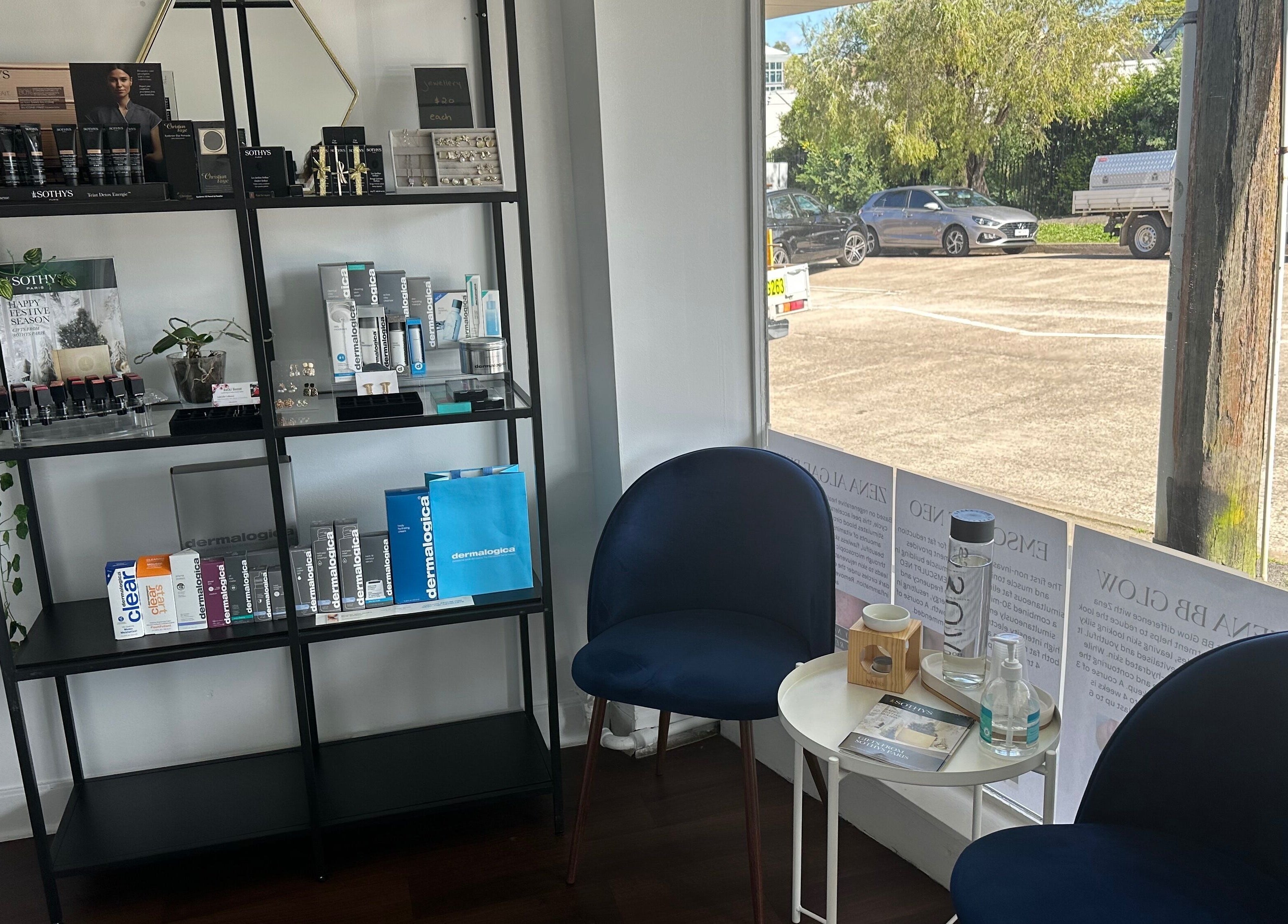 Skinplus Pymble, New South Wales, AU lounge area with skincare display and seating.