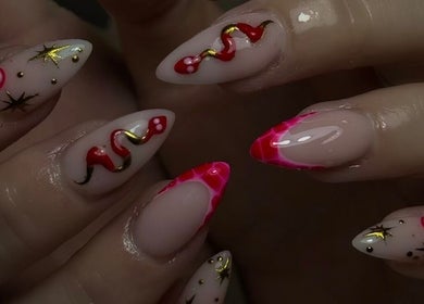 Intricate nail art design at Nail Luxe, Nantwich, England, GB showcasing a blend of vibrant colors and patterns.