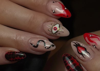 Vibrant nail art at Nail Luxe, Nantwich, England, GB, showcasing bold patterns and intricate designs.