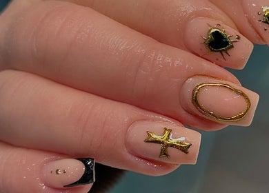 Chic black and gold nail art at Nail Luxe, Nantwich, England, GB, showcasing luxury nail designs.