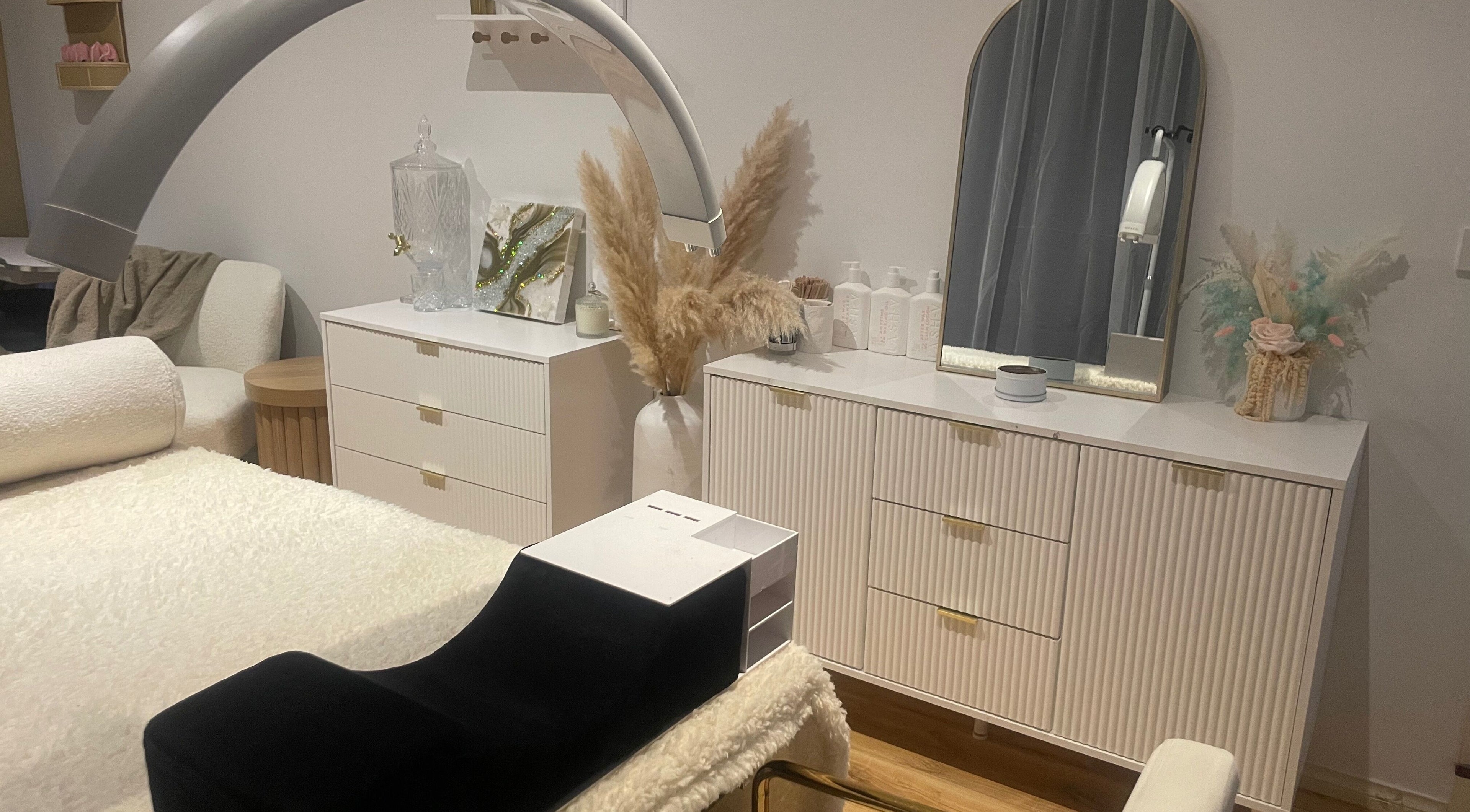 Relaxing treatment room at Kylie’s Beauty Salon, Melbourne, Victoria, AU featuring modern decor and plush seating.