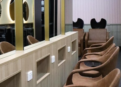 Luxurious seating at W Hair Lounge, Hurstville, New South Wales, AU. Mirrors and chairs create a serene ambiance.