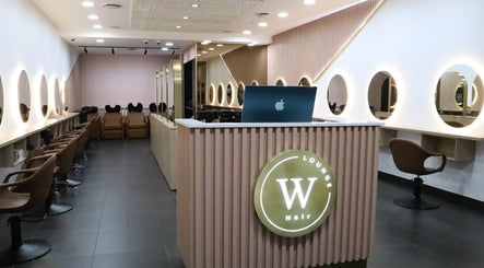 Modern salon interior at W Hair Lounge, Hurstville, New South Wales, AU with sleek design and warm lighting.