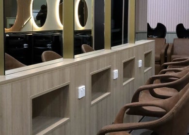 Modern seating and mirrors at W Hair Lounge, Hurstville, New South Wales, AU, showcasing elegant salon design.