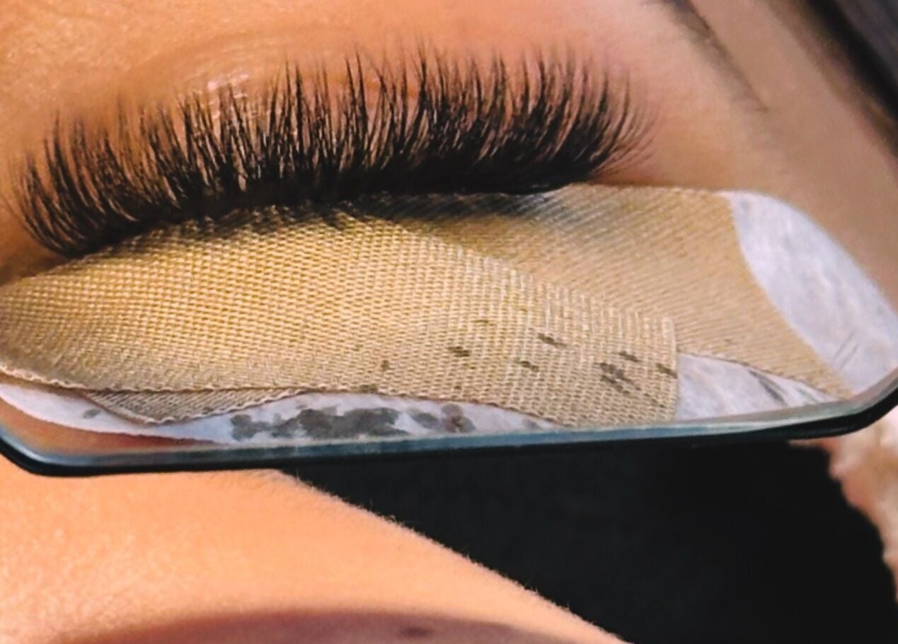 Close-up of eyelash extensions reflected in a mirror at Thelashlounge, Cape Town, Western Cape, ZA.