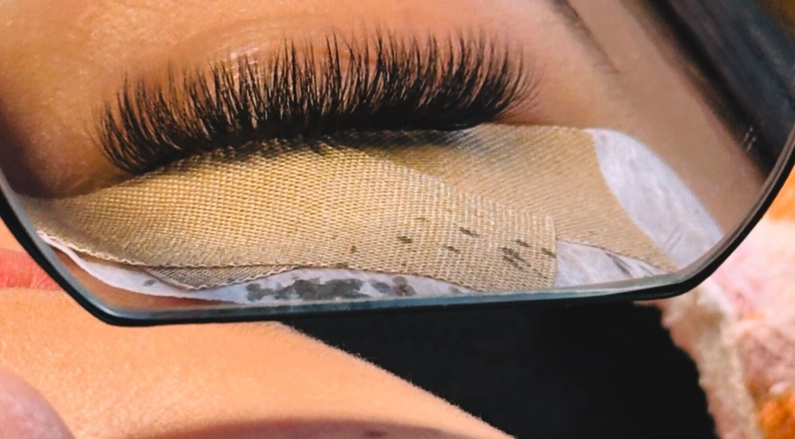 Close-up of eyelash extensions reflected in a mirror at Thelashlounge, Cape Town, Western Cape, ZA.