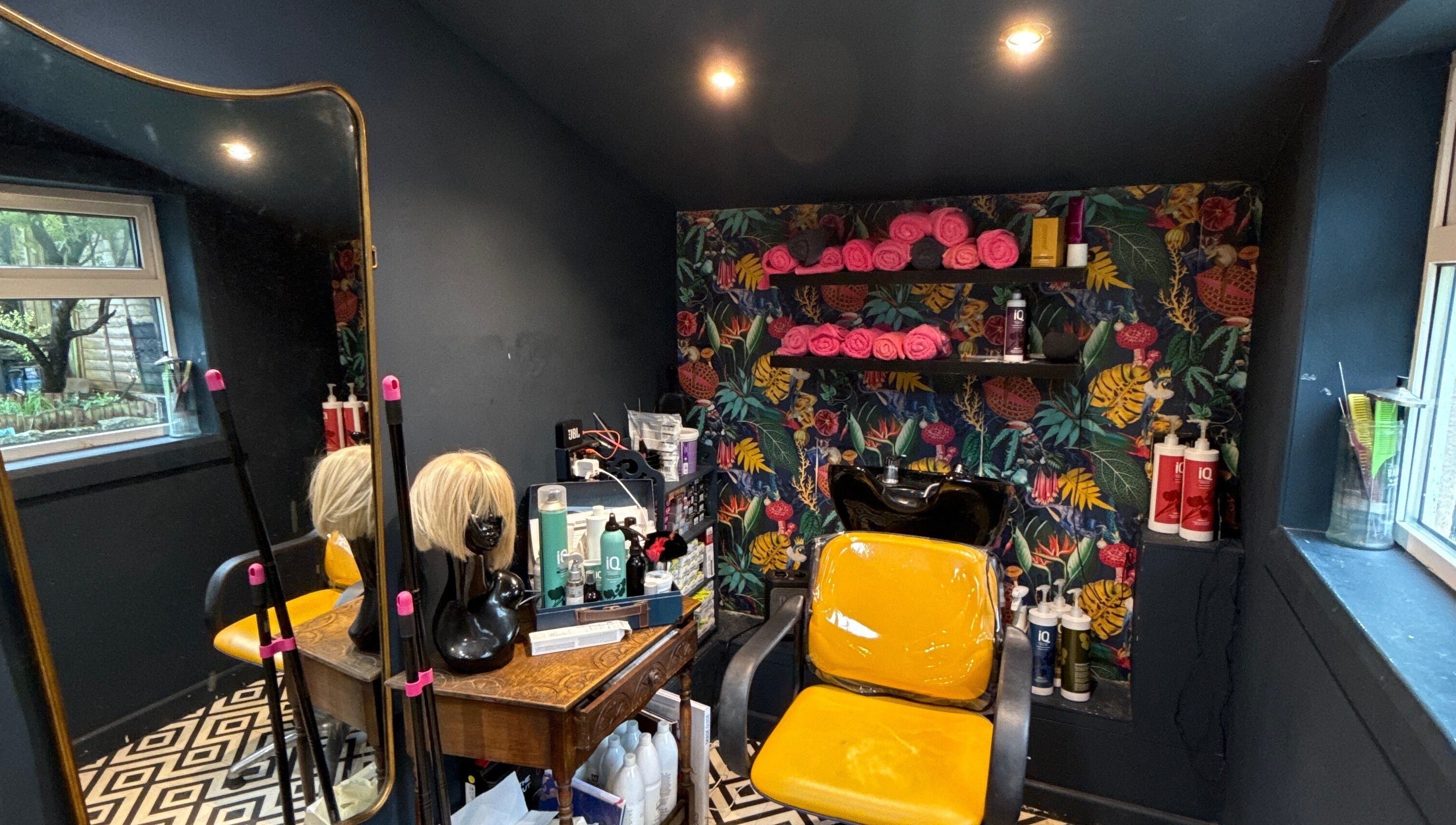 Bright and cozy salon corner at Hush Secret Salon, Bristol, United Kingdom, GB with chic decor and styling chair.