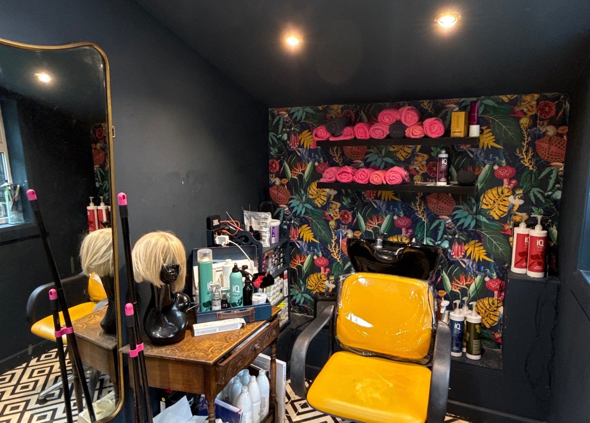 Bright and cozy salon corner at Hush Secret Salon, Bristol, United Kingdom, GB with chic decor and styling chair.