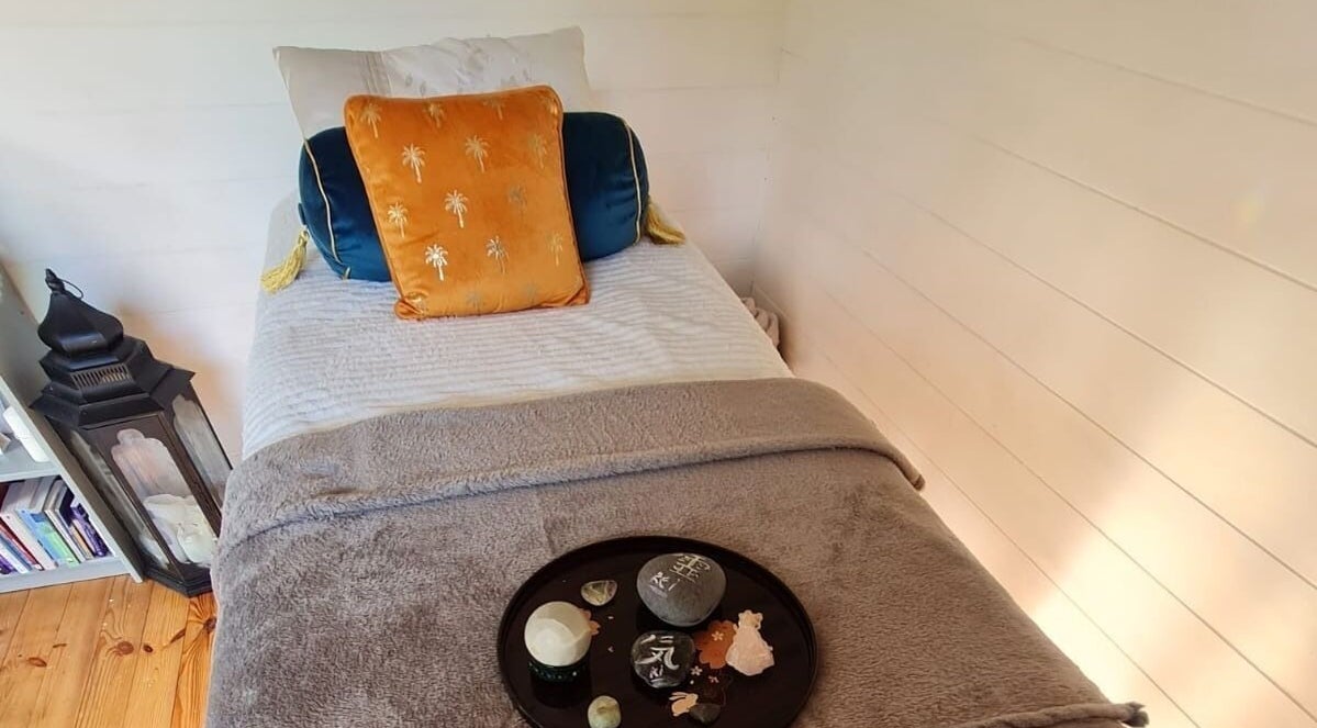 Relaxing bed setup with soft pillows at The Healing Room, Dublin, Dublin, IE.