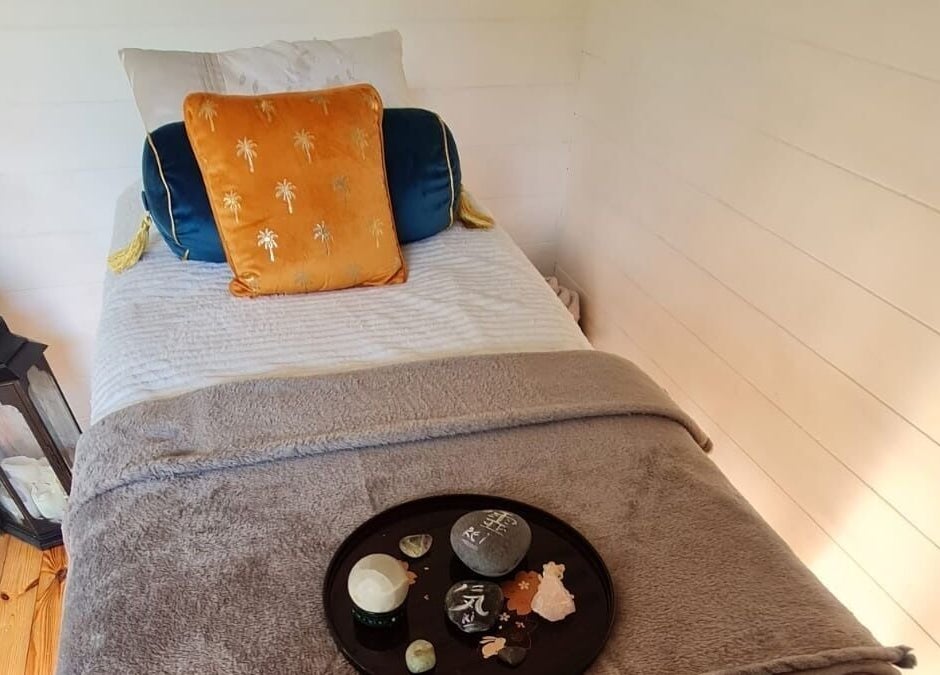 Cozy treatment room at The Healing Room, Dublin, Dublin, IE with a plush bed and calming decor.