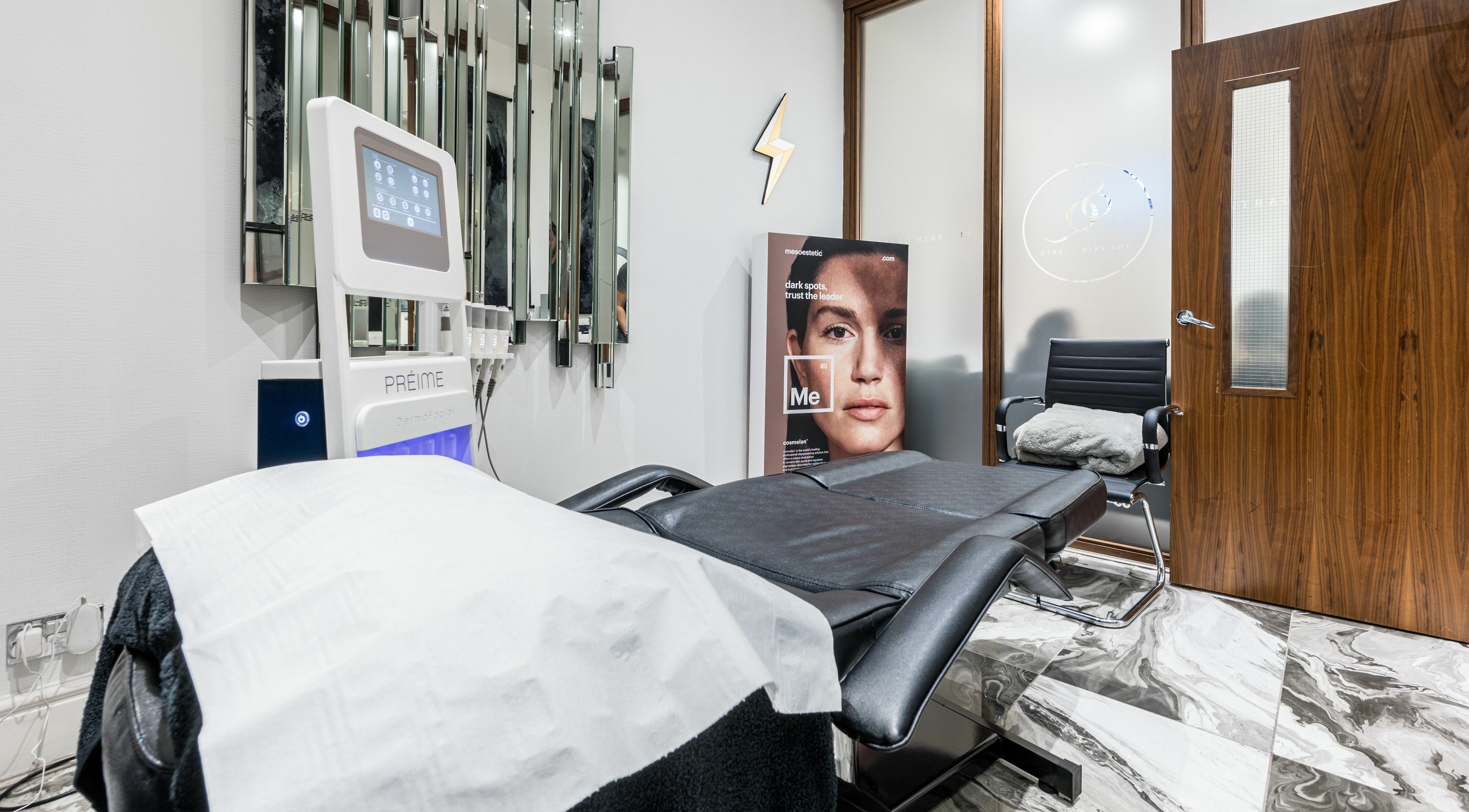 Calm and modern therapy room at The Skin Quartz, Manchester, England, GB, featuring advanced skincare equipment.