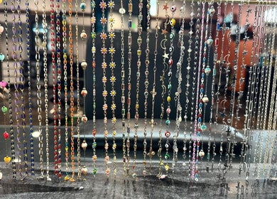 Vibrant jewelry display at Polished by Jillian, showcasing colorful chains in Winnemucca, Nevada, US.