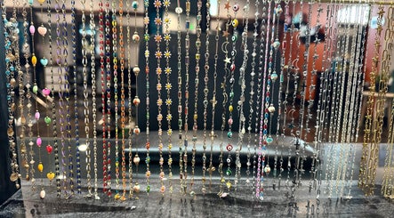 Vibrant jewelry display at Polished by Jillian, showcasing colorful chains in Winnemucca, Nevada, US.