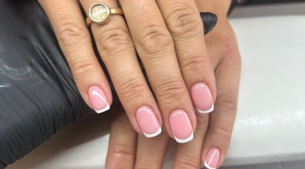 Elegant French manicure at Fiona Watton Beauty, Bude, England, GB, exhibiting perfect craftsmanship.
