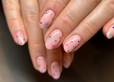 Elegant nail art with stars at Fiona Watton Beauty, Bude, England, GB, showcasing detailed manicure.