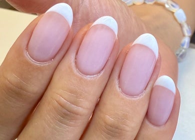 Close-up of French manicure nails at Fiona Watton Beauty, Bude, England, GB.