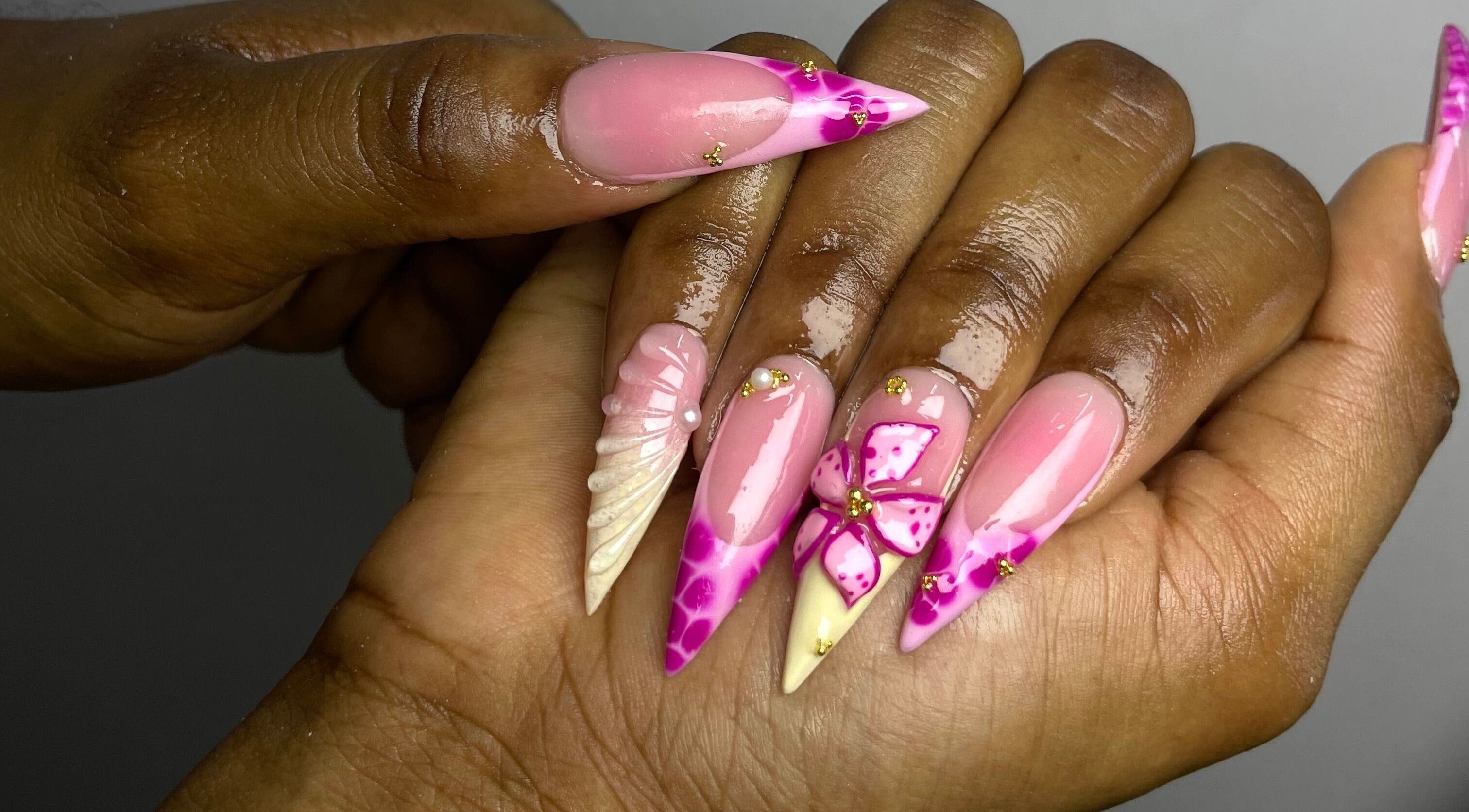 Intricate nail design at The Nail Guru Ja in Kingston, St. Andrew Parish, JM. Features pink and floral accents.