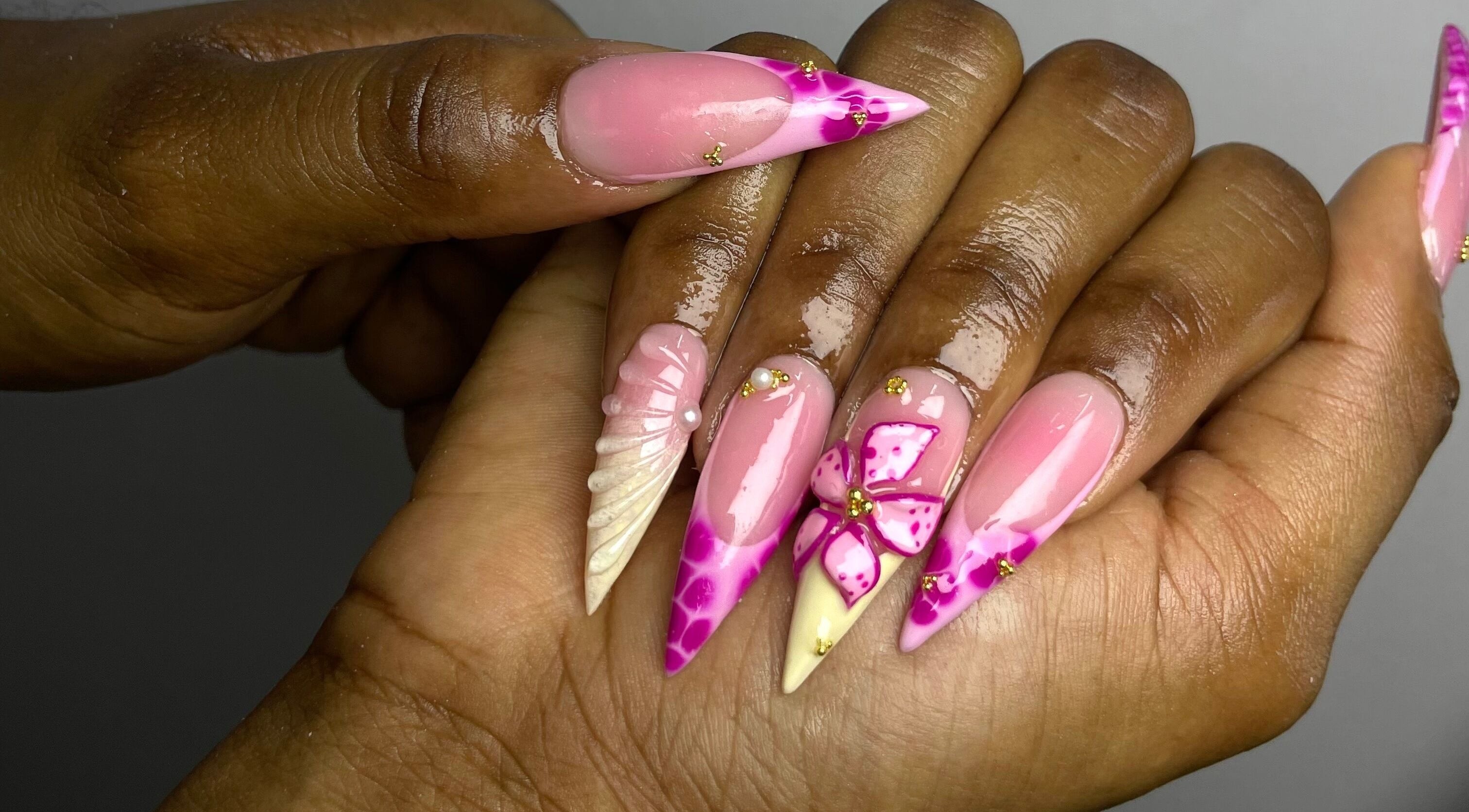 Intricate nail design at The Nail Guru Ja in Kingston, St. Andrew Parish, JM. Features pink and floral accents.