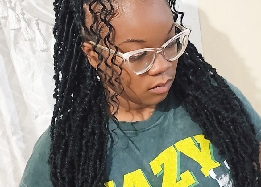 Elegant locs hairstyle at Zaphina Locs, Bridgetown, Saint Peter, BB, showcasing intricate design.