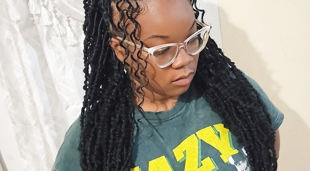 Elegant locs hairstyle at Zaphina Locs, Bridgetown, Saint Peter, BB, showcasing intricate design.