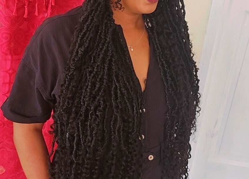 Woman with long, stylish locs at Zaphina Locs in Bridgetown, Saint Peter, BB.