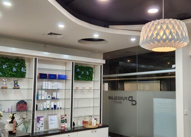 Chic interior of PUREGLAM BEAUTY in Melbourne, Victoria, AU featuring elegant decor and beauty product displays.