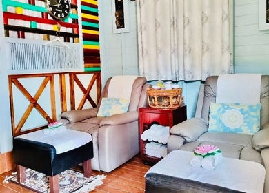 Relaxing massage chairs at Thai Rose Massage Center in Ajman, AE, offering comfort and tranquility.