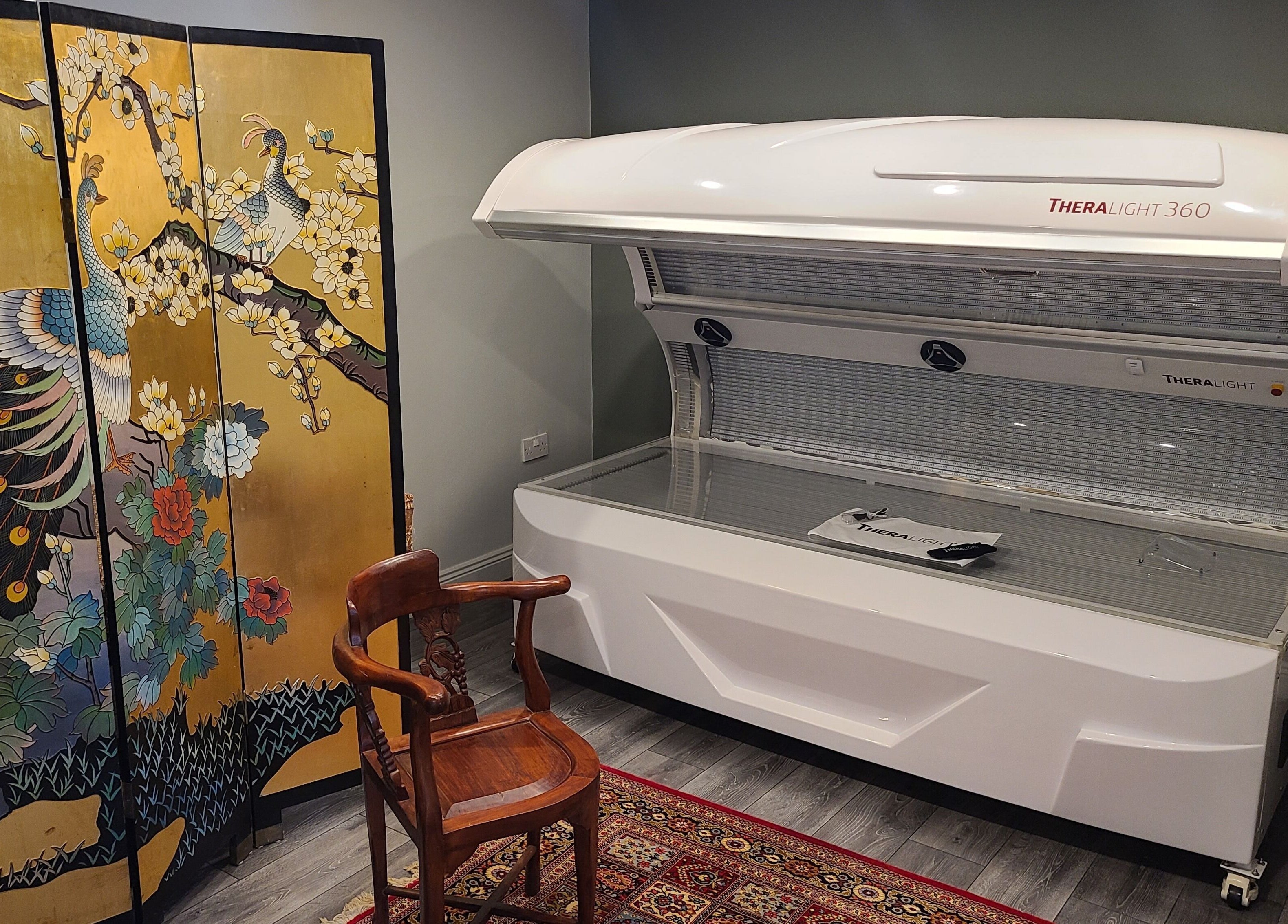 TheraLight 360 and peacock screen at Phoenix Wellness, Gorey, Ireland, IE. A tranquil therapy space.