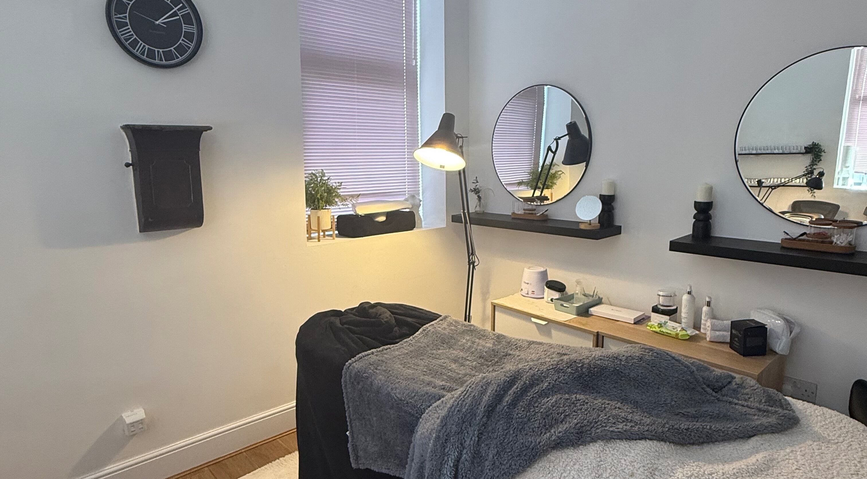 Relaxing treatment room at Cloudnine beauty studio in Milnrow, England, GB with soothing decor and gentle lighting.