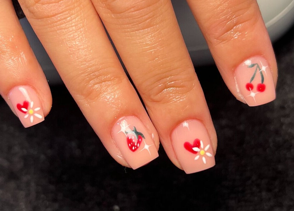Chic nail art with fruits and flowers at Cloudnine beauty studio, Milnrow, England, GB.