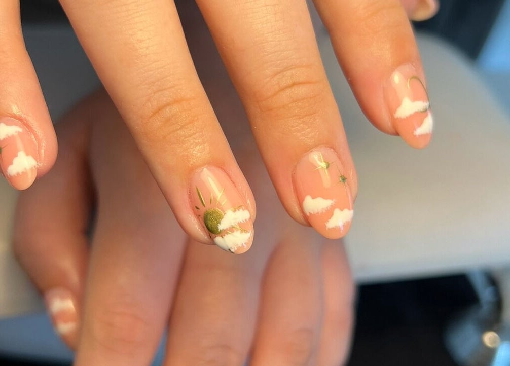 Cloudnine beauty studio in Milnrow, England offers artistic cloud-themed nail designs.
