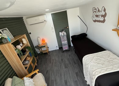 Cozy room at The Lash Suite, Tokoroa, NZ featuring a treatment bed and stylish decor for relaxation.