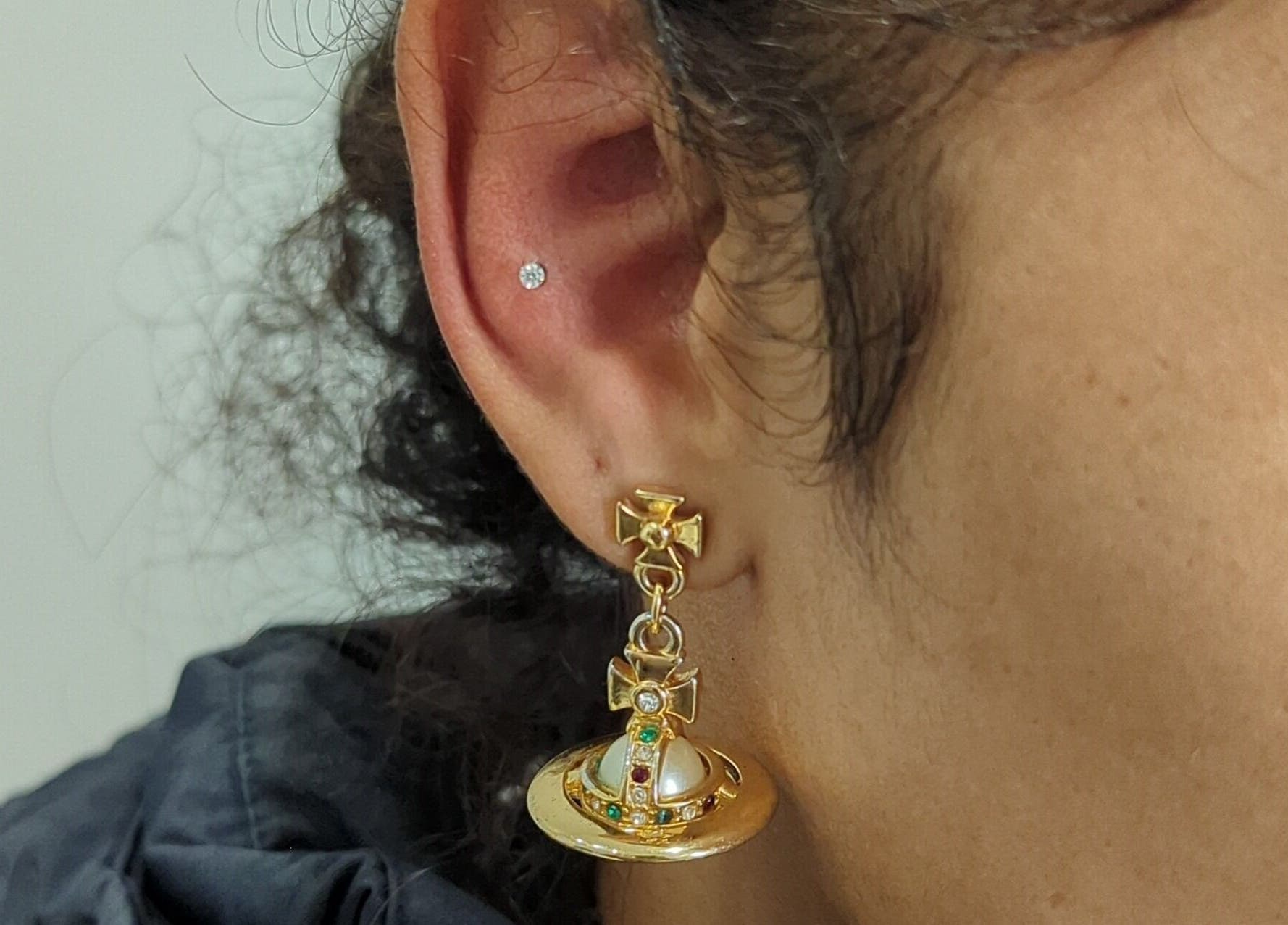 Elegant gold earrings at Martinachristine Beauty Studio - Skin Deep Tattoo, Belvedere, England, GB.