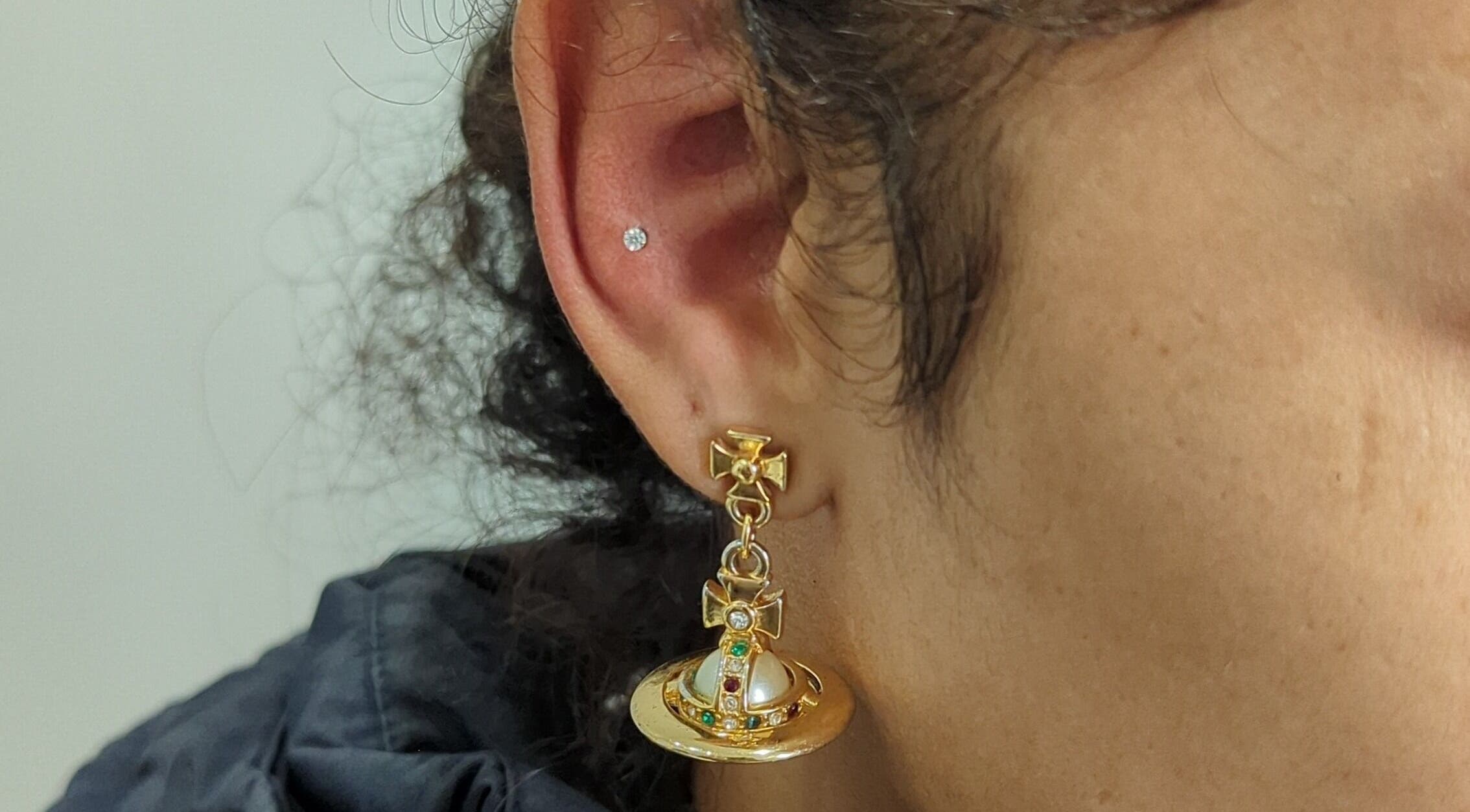 Elegant gold earrings at Martinachristine Beauty Studio - Skin Deep Tattoo, Belvedere, England, GB.