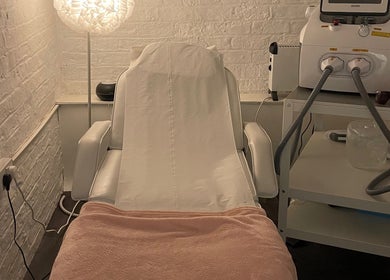 Peaceful treatment room at Elevate in Ripon, England, GB, featuring a cozy chair and equipment for relaxation.