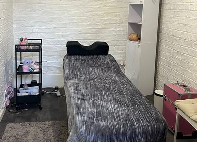 Calm treatment room at Elevate, Ripon, England, GB, featuring a massage bed with cozy decor.