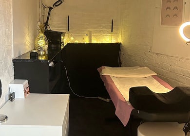 Cozy treatment room at Elevate, Ripon, England, GB, featuring a plush bed and ambient lighting.