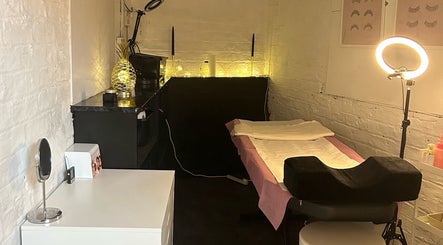 Cozy treatment room at Elevate, Ripon, England, GB, featuring a plush bed and ambient lighting.