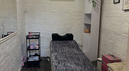 Cozy treatment room at Elevate, Ripon, England, GB, featuring a bed and wellness accessories.