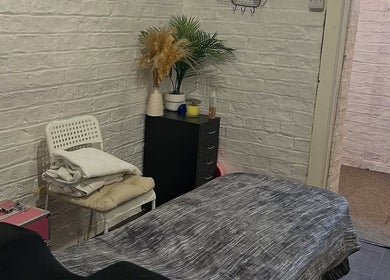 Tranquil treatment room at Elevate in Ripon, England, GB with cozy linens and calming decor.