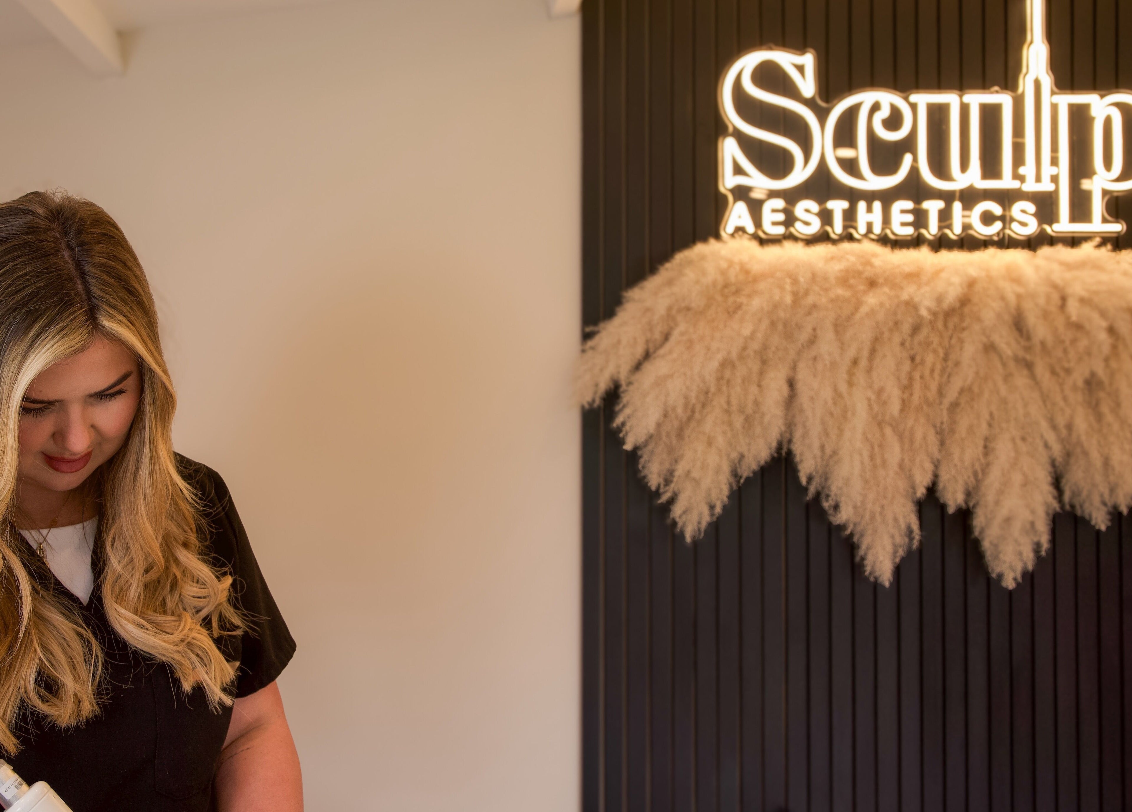 Sculpt Aesthetics Clinic in Barlaston, England featuring a welcoming ambiance with staff and stylish decor.