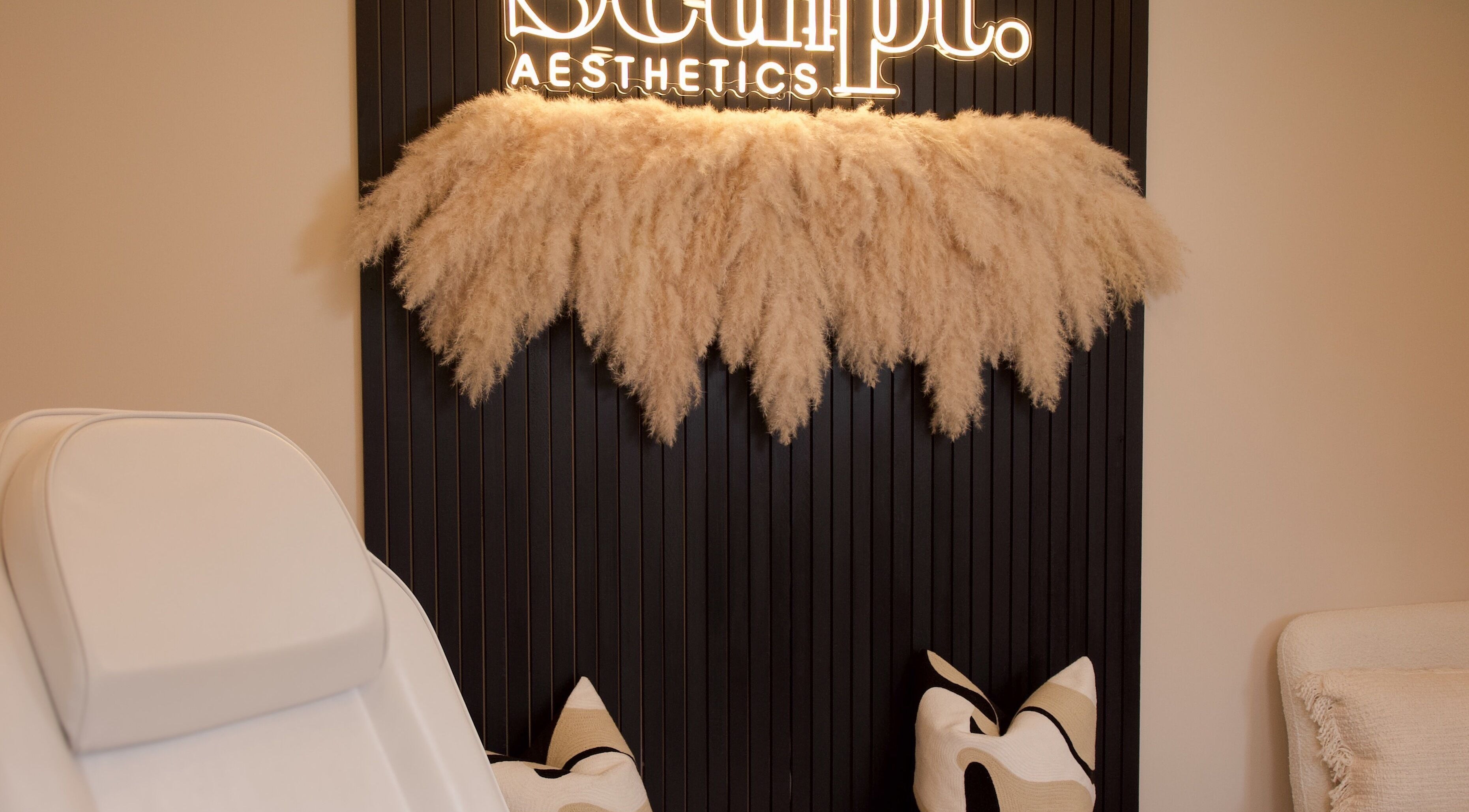Elegant treatment room at Sculpt Aesthetics Clinic in Barlaston, England, featuring plush decor and a serene atmosphere.
