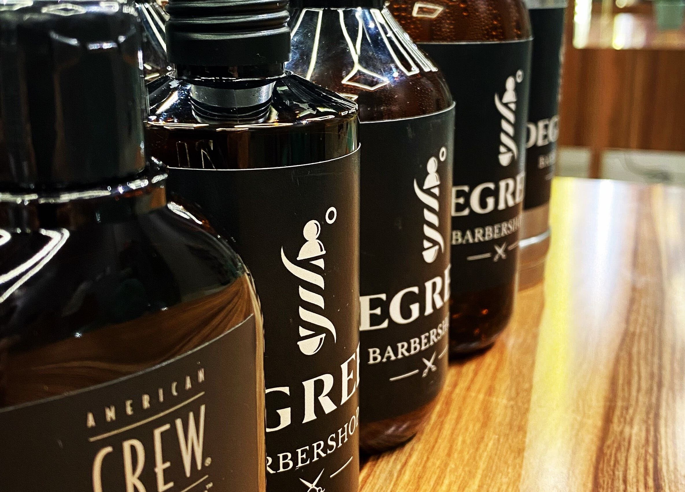 Close-up of grooming products at Degrees Barbershop, Riyadh, SA. Premium hair care essentials on display.