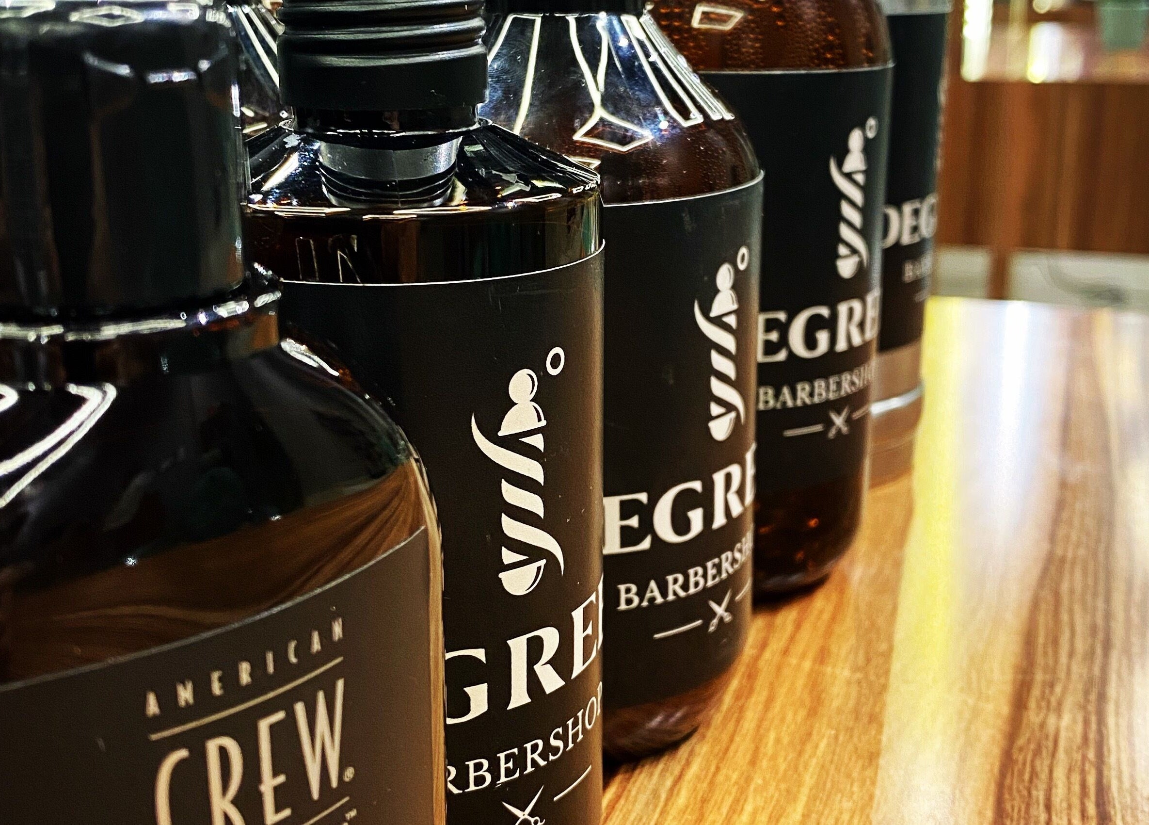 Close-up of grooming products at Degrees Barbershop, Riyadh, SA. Premium hair care essentials on display.