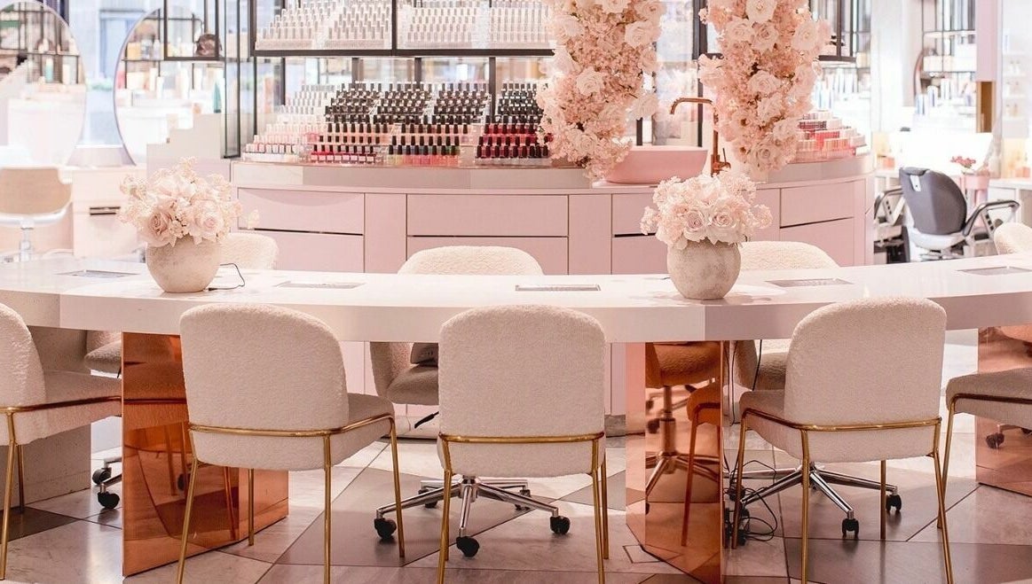 Chic interior of Nail'd It London Pasadena, featuring plush seating and floral decor in Pasadena, California, US.