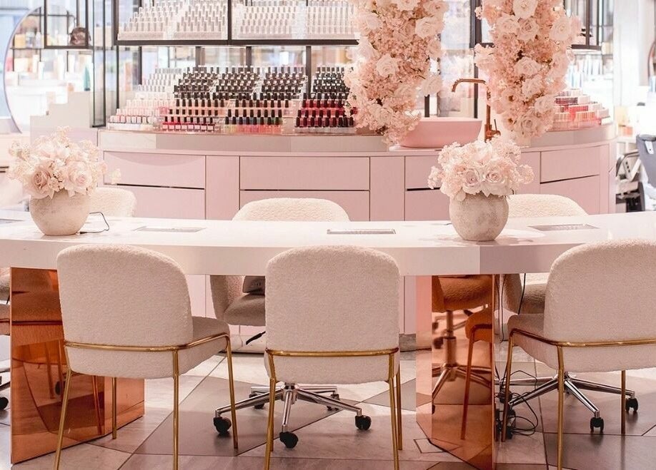 Chic interior of Nail'd It London Pasadena, featuring plush seating and floral decor in Pasadena, California, US.