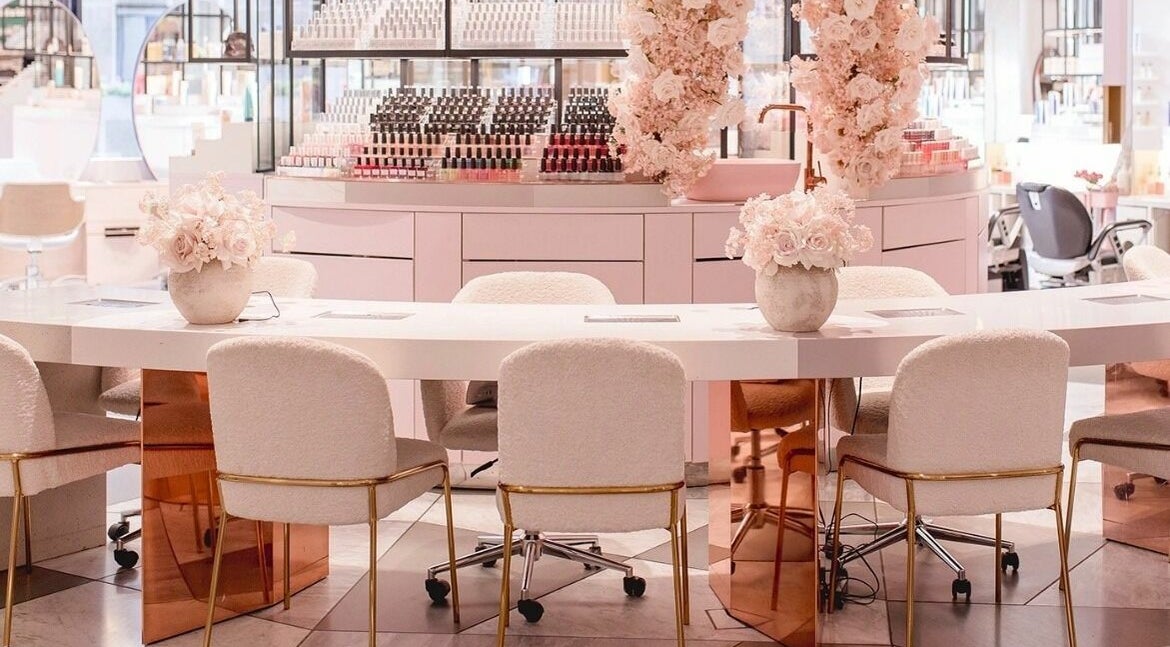 Chic interior of Nail'd It London Pasadena, featuring plush seating and floral decor in Pasadena, California, US.
