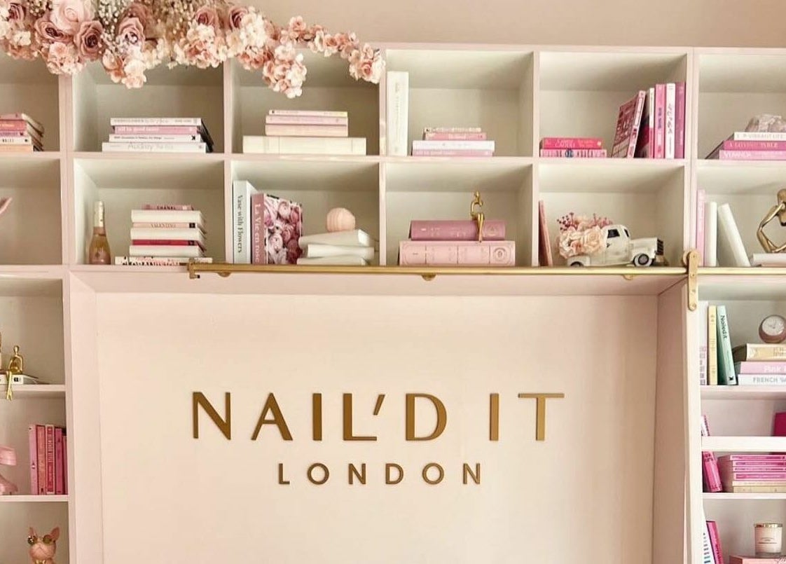 Elegant bookshelf at Nail'd It London Pasadena, featuring pink decor in Pasadena, California, US.