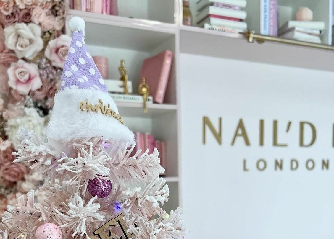 Christmas decor at Nail'd It London Pasadena in Pasadena, California, US with pink tree and floral accents.