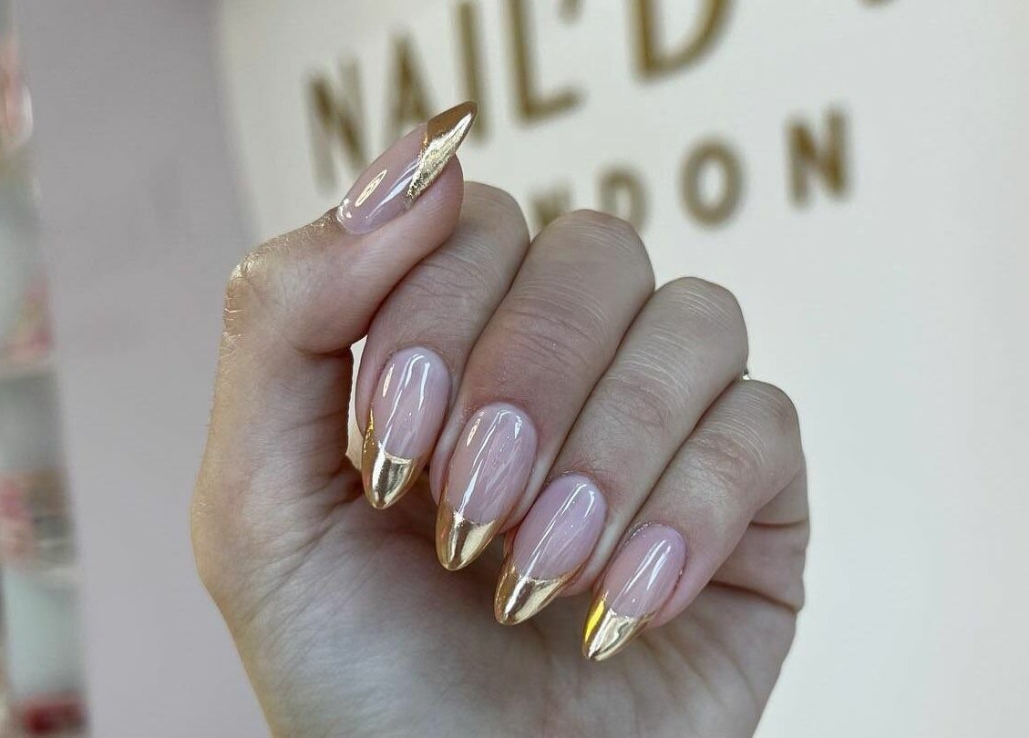 Elegant gold-tipped nails at Nail'd It London Pasadena in Pasadena, California, US, showcasing unique nail art.